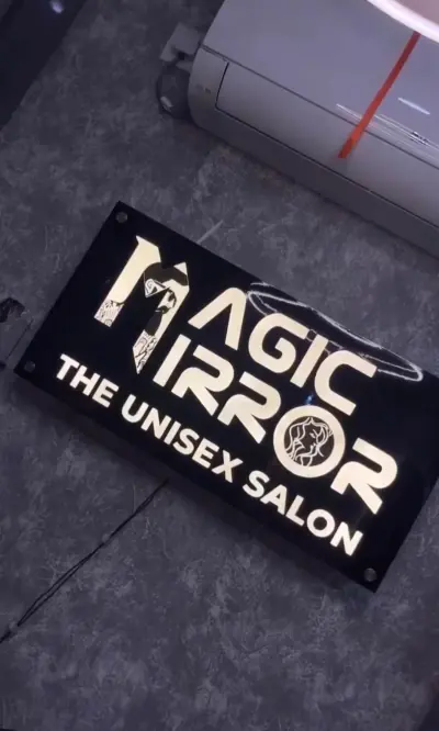 Magic Mirror salon sign in a dark modern interior